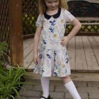 Prisma with pleated skirt and Peter Pan collar